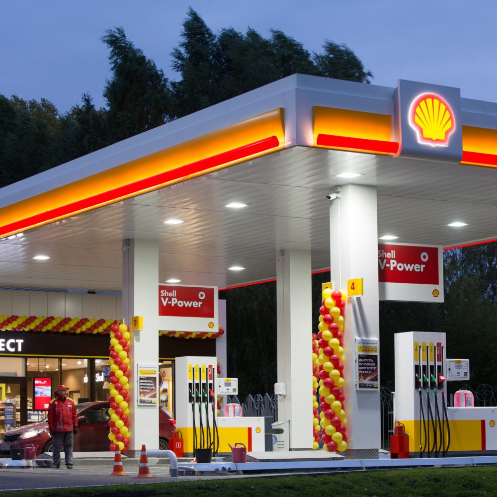 An attendant waits for customers on the forecourt of a newly opened gas station, operated by Royal Dutch Shell Plc, in Kemerovo, Russia, on Friday, Sept. 14, 2018. Royal Dutch Shell plans to double the number of its petrol stations in Russia to 450, says Sergey Starodubtsev, the director-general of Shell Neft, the company's Russian subsidiary. Photographer: Andrey Rudakov/Bloomberg